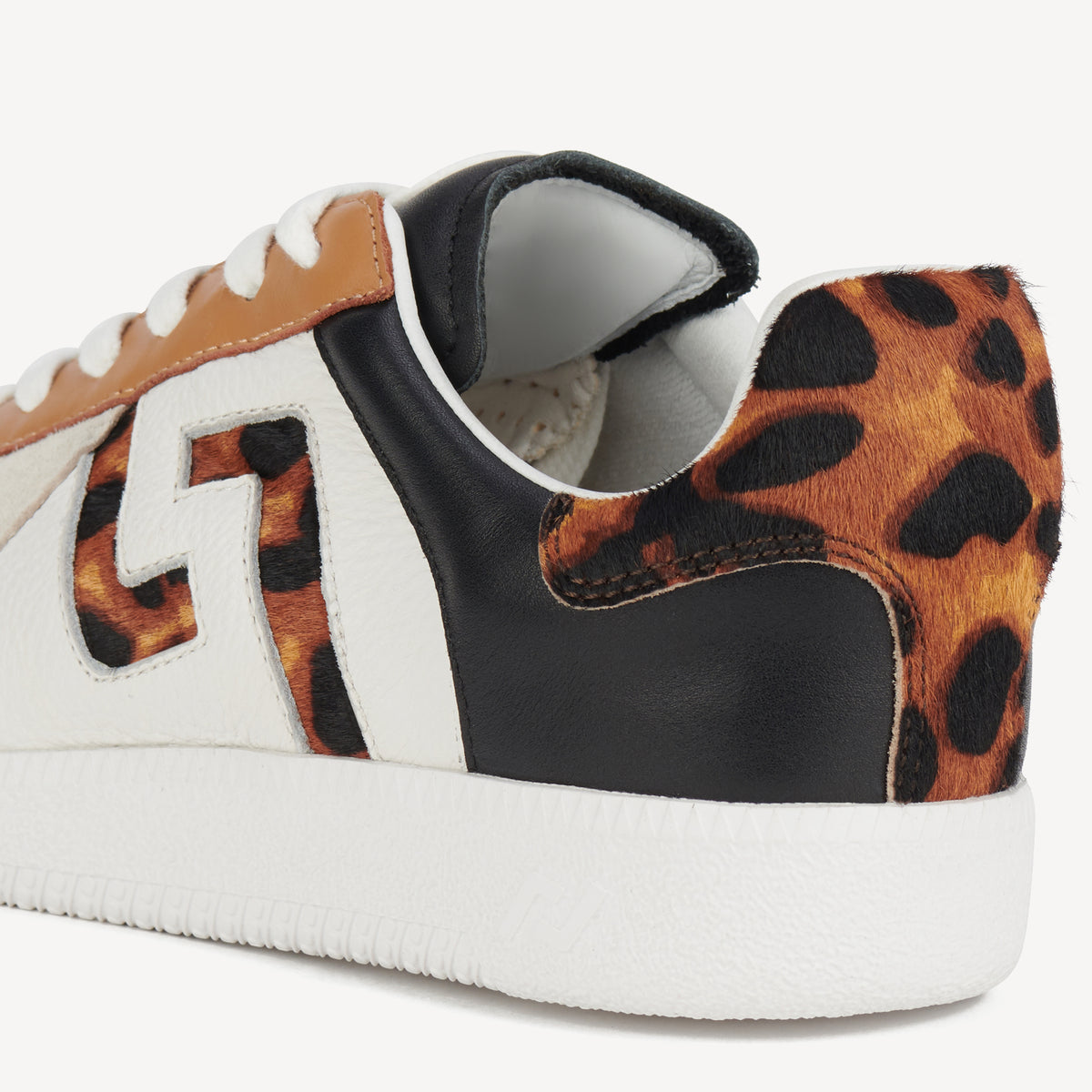 Rollie Pace White/Dark Camel Leopard — white leather sneaker, leopard-print heel, styled campaign shot (2)