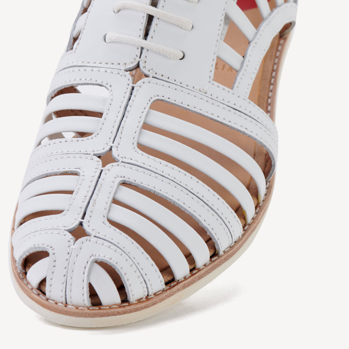 Rollie Sidecut Cage White — women's shoe, angled three-quarter view