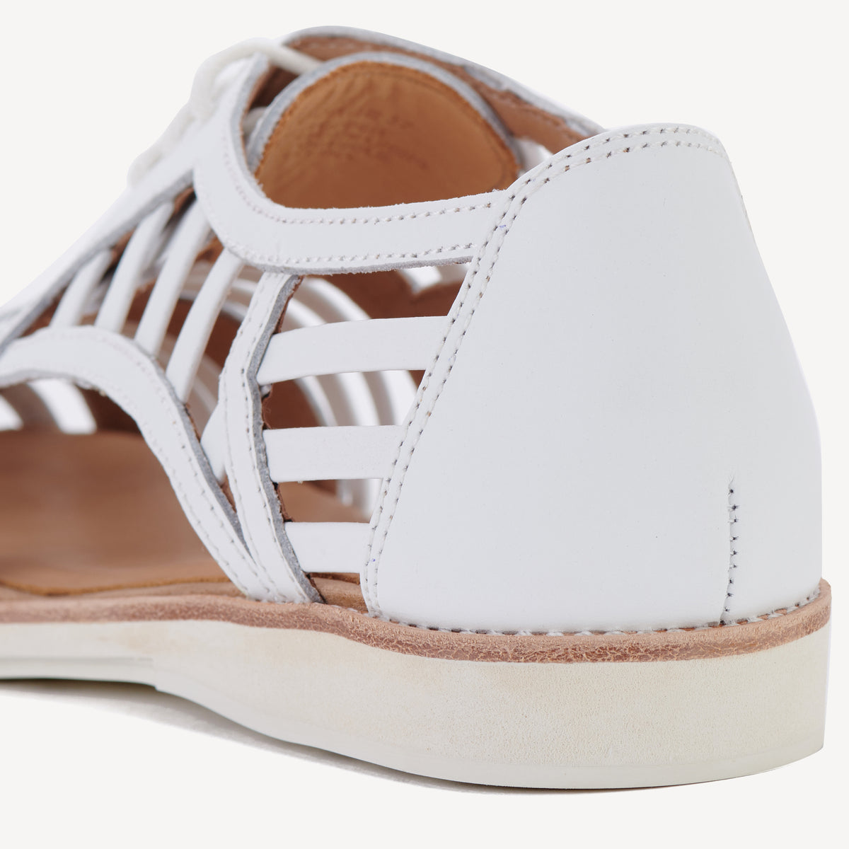 Rollie Sidecut Cage White — women's shoe, heel and back view