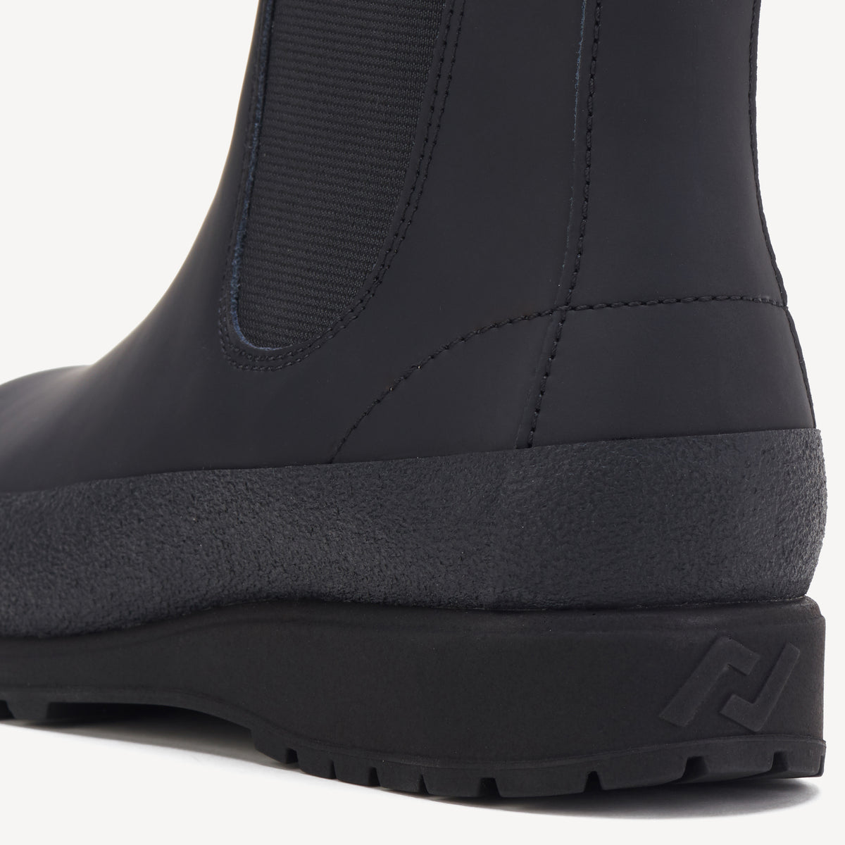 Rollie Fields Chelsea Rubberised Black — black rubberised Chelsea boot, styled campaign shot (2)