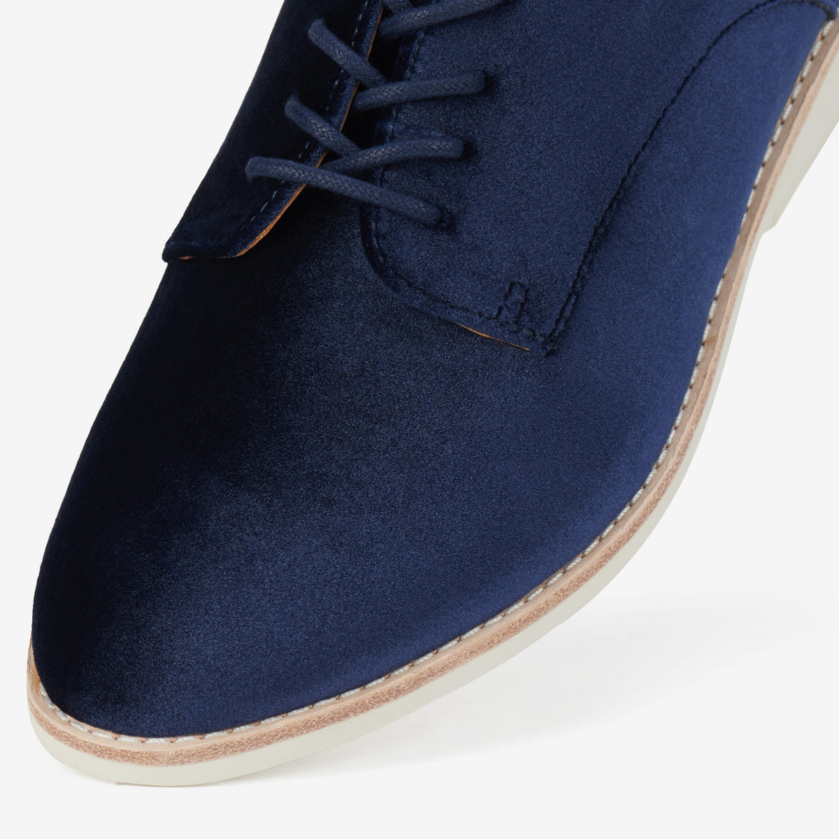 Rollie Derby Navy Velvet — women's velvet lace-up shoe, styled campaign shot