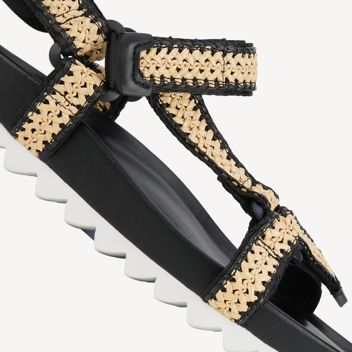 Rollie Sandal Tooth Wedge Black/White Raffia — women's sandal, angled three-quarter view